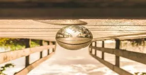 pexels-photo-831886-831886 Artistic reflection of a bridge captured in a glass sphere, showcasing a creative perspective.